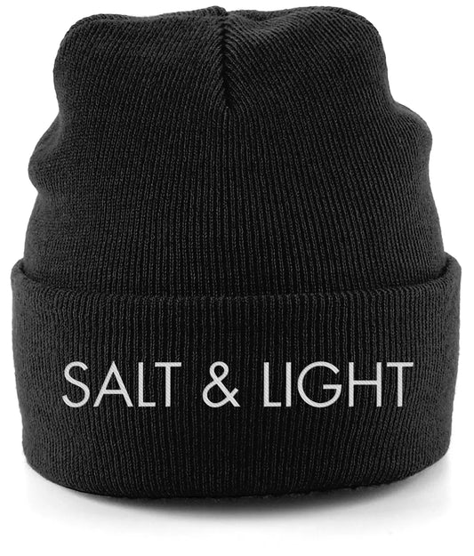 Close-up of a Black cuffed beanie featuring high-quality white embroidery of the words 'SALT & LIGHT' in a modern, bold font