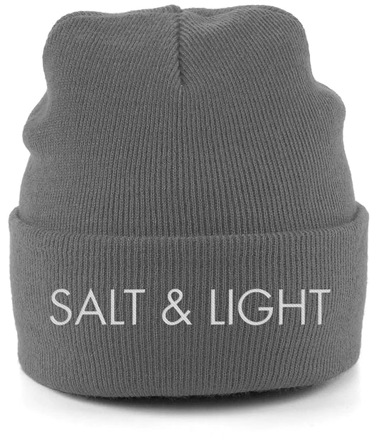 Close-up of a graphite grey cuffed beanie featuring high-quality white embroidery of the words 'SALT & LIGHT' in a modern, bold font