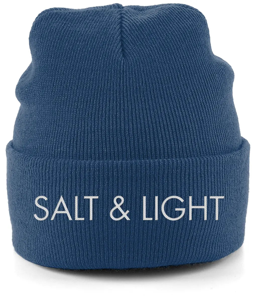 Close-up of a oxford Blue cuffed beanie featuring high-quality white embroidery of the words 'SALT & LIGHT' in a modern, bold font