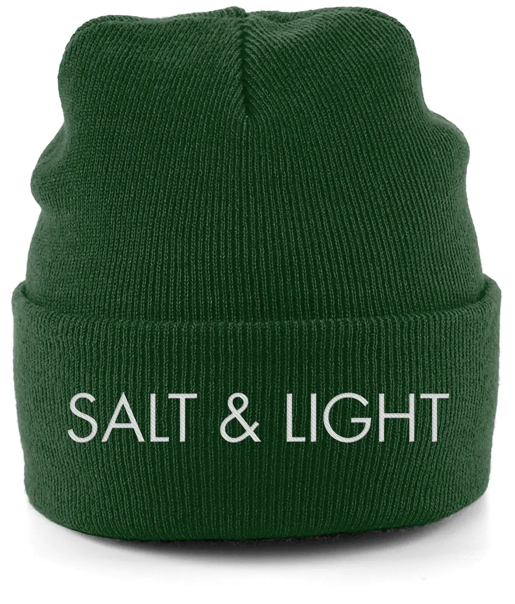 Close-up of a mustard Green cuffed beanie featuring high-quality white embroidery of the words 'SALT & LIGHT' in a modern, bold font